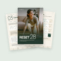 Portada de RESET 28 con dos páginas interiores: un día de entrenamiento y el calendario de 28 días
